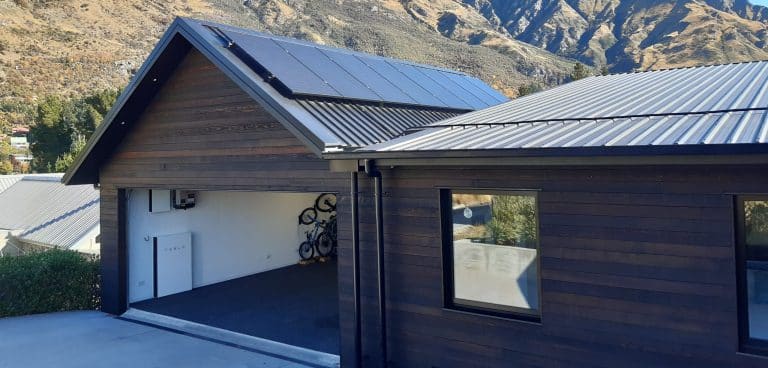 Tesla Powerwall and Solar Panels on Garage  scaled e1681952353486