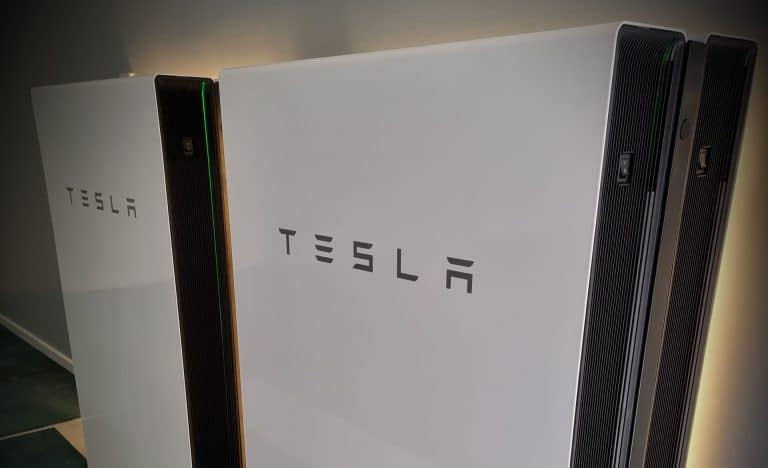 Tesla Powerwall backlit angle view 1 scaled e1682651284138